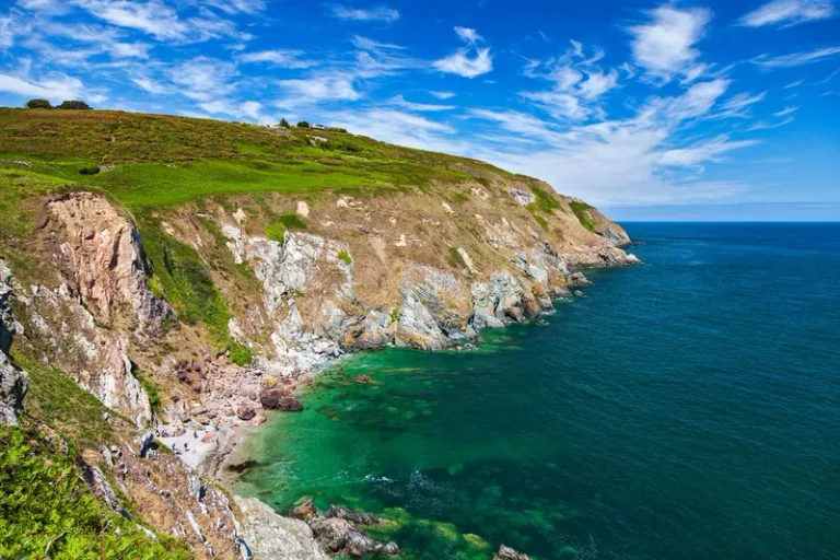 Green cliffs and a walking path above the sea at Howth Head, County Dublin.