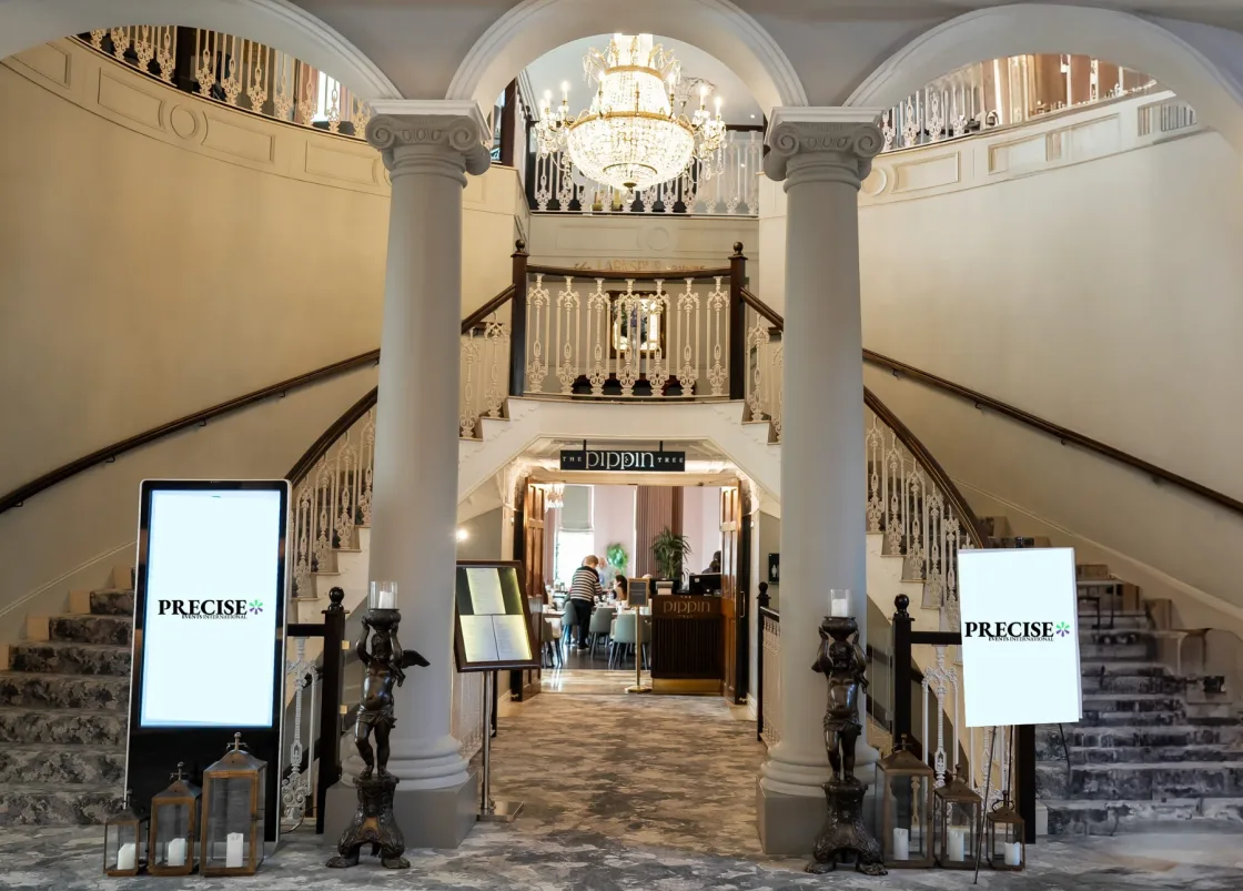 PRECISE digital welcome screens beneath an arched hotel entrance at the Engineering Leadership Summit.