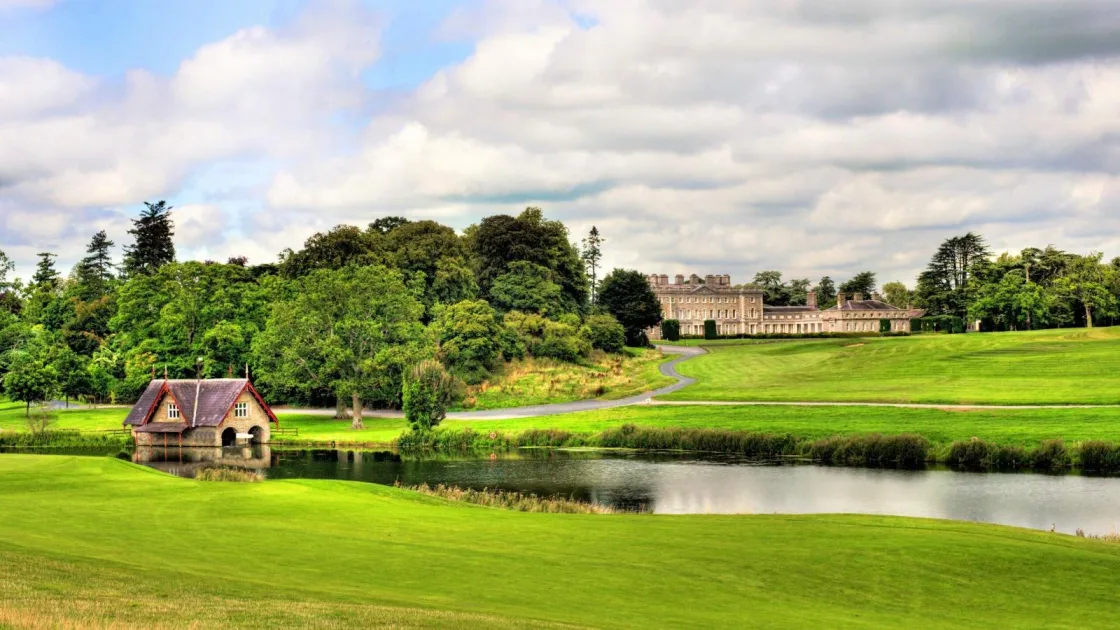 A country estate with lawns, a lake and a small garden building.