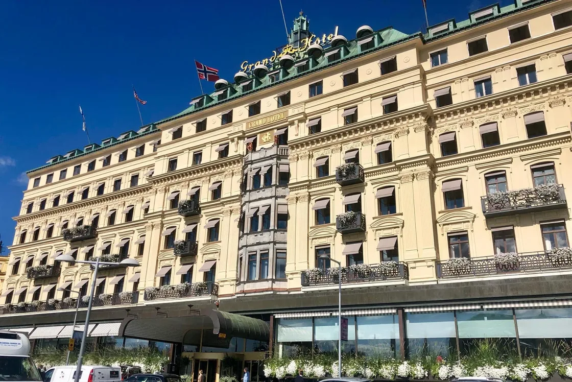 An ornate city hotel facade with a ground-floor awning.