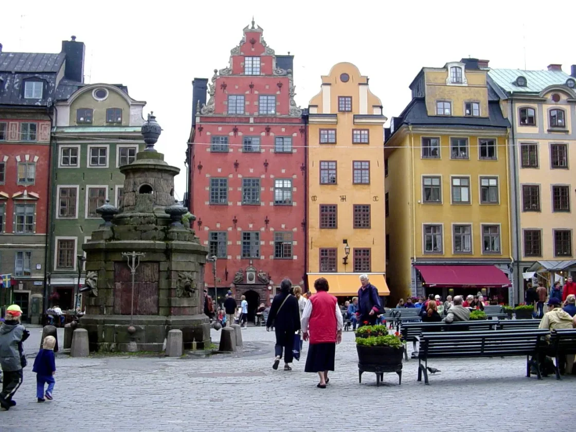 Colourful historic buildings overlooking a cobbled city square.